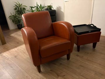 Bruin leren fauteuil met hocker - opzetplank