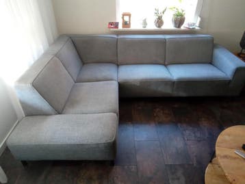 Comfortabele grijze/blauwe hoekbank met chaise longue