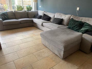 Gratis af te halen grijze hoekbank met chaise longue