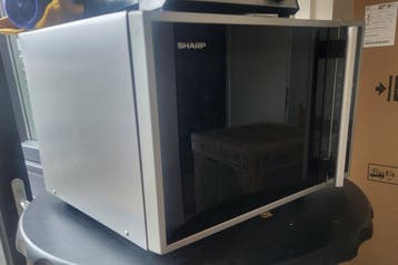 Sharp combi magnetron half werkend