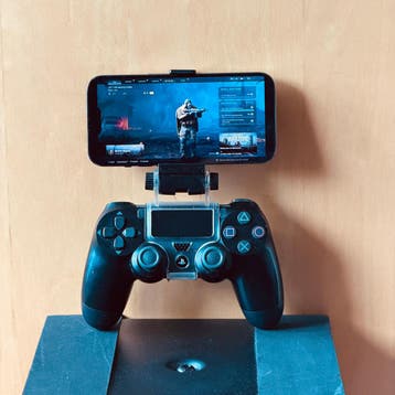 DualShock 4 controller + telefoonhouder – defect – GRATIS
