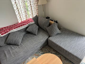 Grey corner sofa with light wear