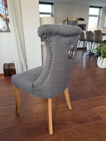 8 Luxe eetkamerstoelen grijs met ring en nagels