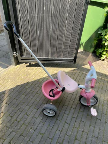 Roze Smoby driewieler met duwstang