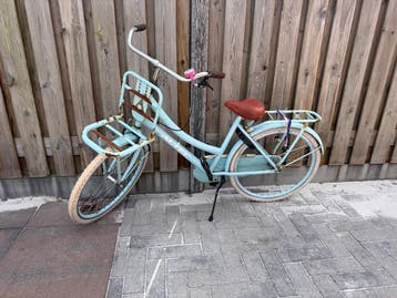 Gratis Lichtblauwe meisjesfiets met voordrager