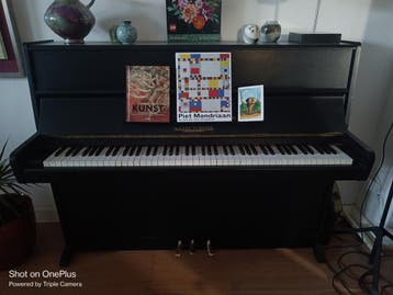 Zwarte piano merk August Förster gratis af te halen