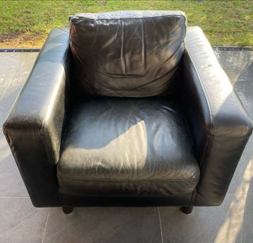 Gratis Natuzzi zwarte leren stoel.