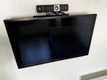 TV met muurophangbeugel - Zonde om weg te gooien!