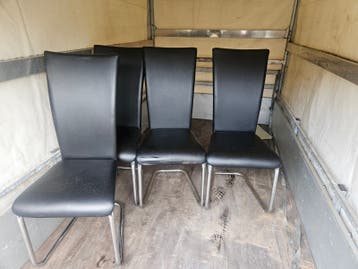 4 zwarte leren stoelen gratis af te halen