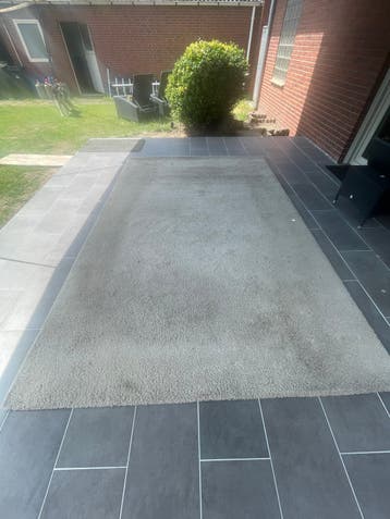 Groot beige vloerkleed