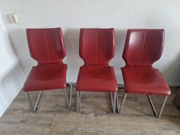 Set van 4 rode stoelen met chromen onderstel