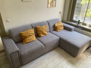 Comfortabele grijze hoekbank met chaise longue