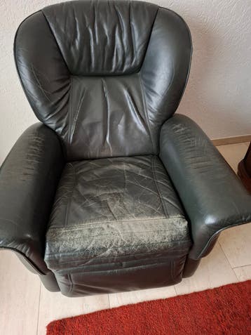 Comfortabele groene leren fauteuil met relaxfunctie