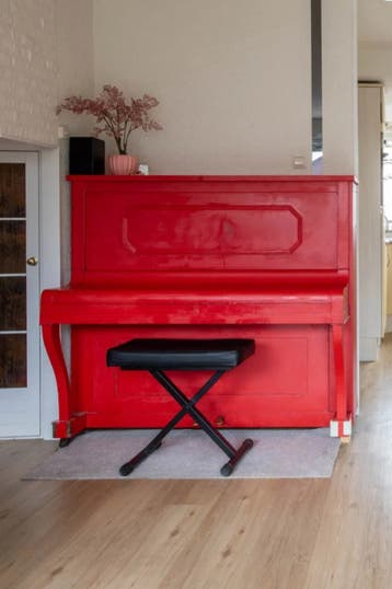 A Well maintained & Tuned Red Hofpner piano