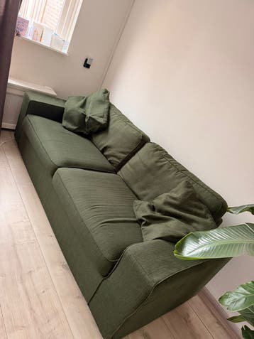 Comfortabele groene tweepersoonsbank