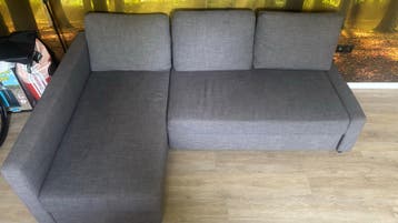 Grijze slaapbank met opbergruimte