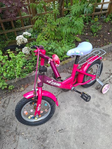 Roze kinderfiets Corvino met zijwieltjes (opknapper)