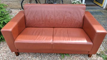 GRATIS Montel cognac leren tweezits bank
