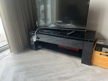 Zwart TV-meubel met glazen blad en lade