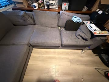 Comfortabele grijze hoekbank - Zo goed als nieuw