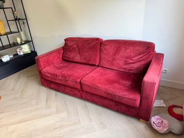 Comfortabele rode tweezitsbank