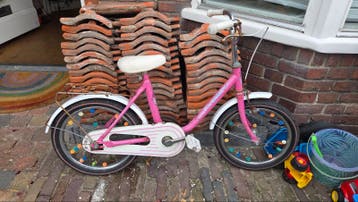 Roze kinderfiets (16 inch)