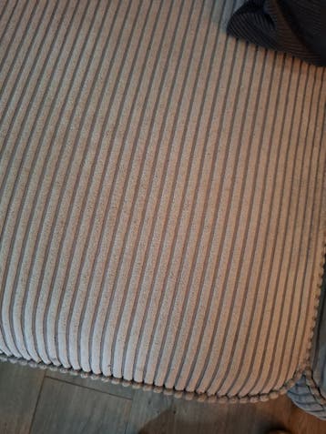 Grote beige ribstof hoekbank