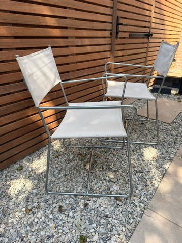 2 stoelen RVS frame met zitvlak van stof