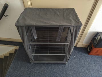 Covered clothe shelf