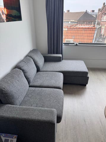 Grijze hoekbank met chaise longue