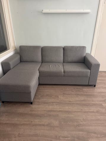 Comfortabele grijze hoekbank - Zo goed als nieuw