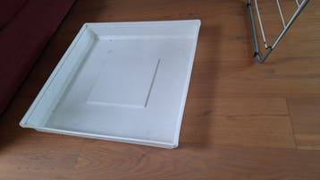 Wasmachine lekbak