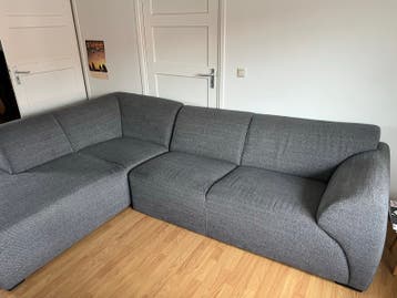 Grijze stoffen hoekbank