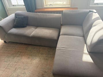Grijze hoekbank met chaise longue