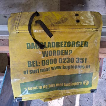 gebruikte dubbele krantenbezorgtas