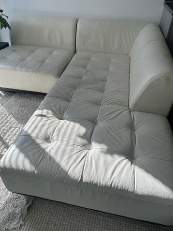 Leren hoekbank en twee fauteuils