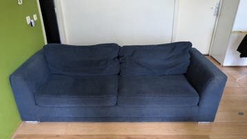 Comfortabele donkerblauwe bank en fauteuil