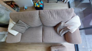 Comfortabele 2,5-zitsbank met hocker, stof, taupekleurig